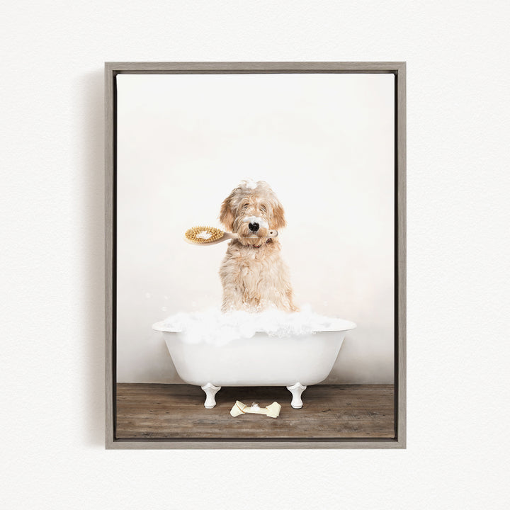 A fluffy dog sitting in a white bathtub, holding a yellow toy in its mouth.