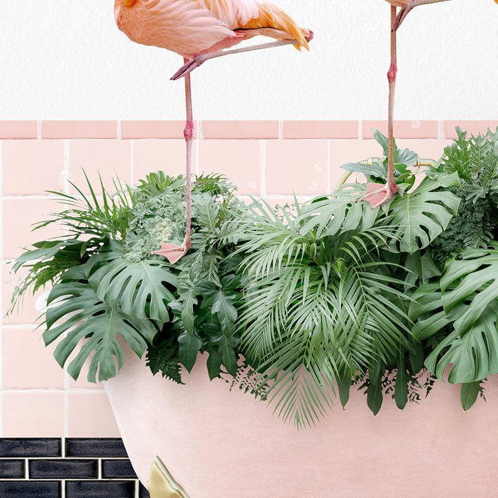 two flamingos standing on top of a plant in a pot