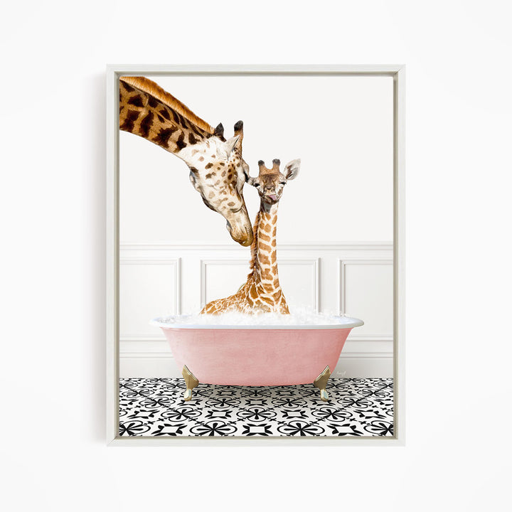 A mother giraffe and her baby giraffe are sitting together in a pink bathtub, with the mother gently nuzzling her baby.