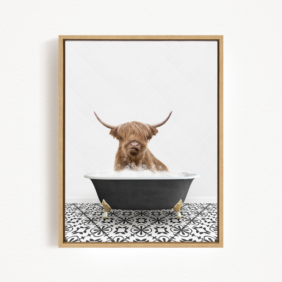 A brown cow with long horns is sitting in a black bathtub filled with water, creating a whimsical and playful scene.