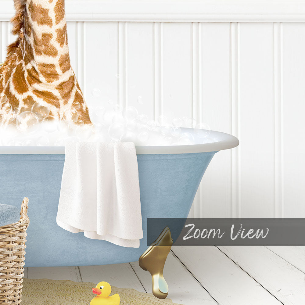 A giraffe standing in a blue bathtub filled with water, with a towel and rubber duck nearby.