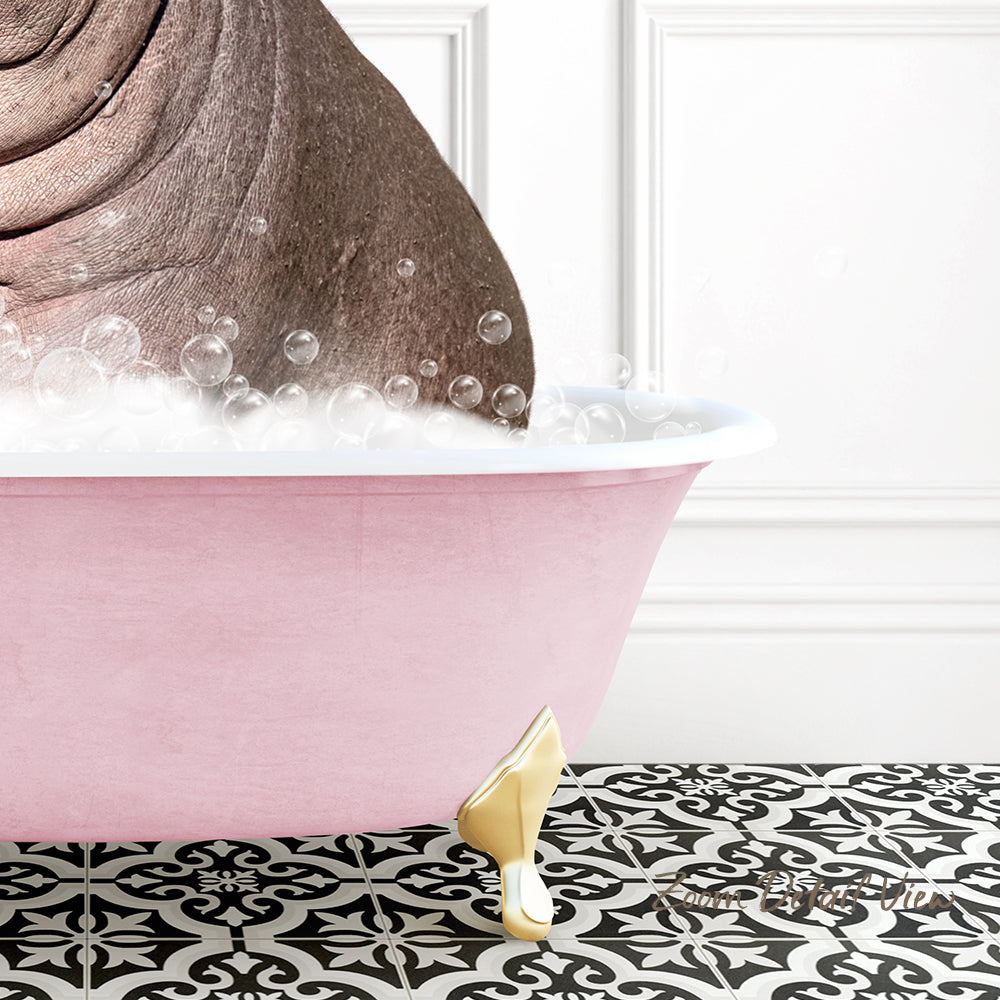A pink bathtub filled with bubbles, with a gold-colored bathtub leg visible, set against a white wall with a black and white patterned floor.