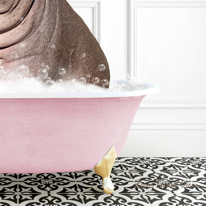 A pink bathtub filled with bubbles, with a gold-colored bathtub leg visible, set against a white wall with a black and white patterned floor.