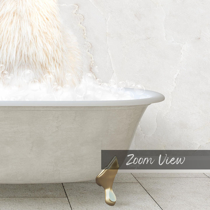 A white bathtub filled with bubbles, with a gold claw-like object resting on the edge.
