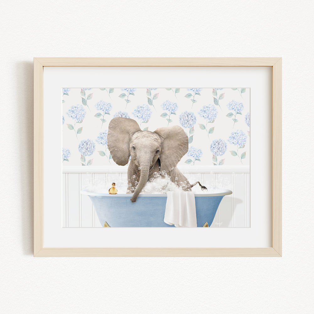 A baby elephant sitting in a blue bathtub, surrounded by blue flowers on the wall behind it.