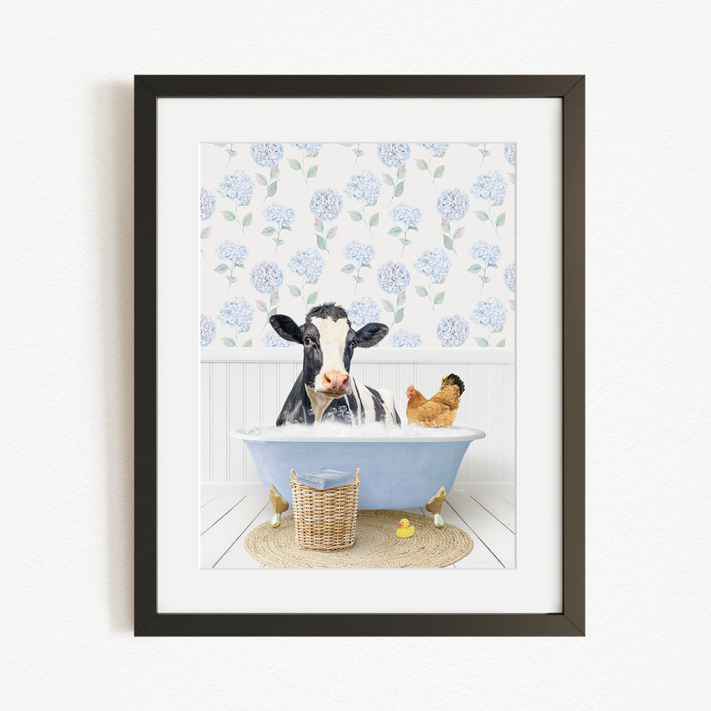 A black and white cow is sitting in a blue bathtub, surrounded by a chicken and a duck, with a blue floral patterned wall behind them.