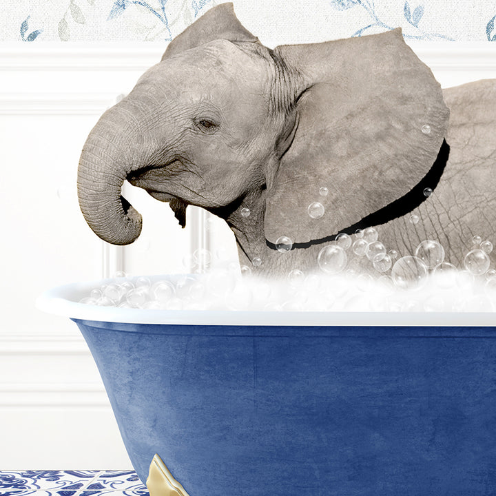 a baby elephant taking a bath in a blue tub