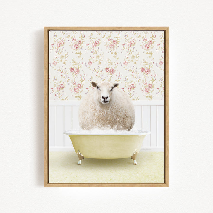 A fluffy white sheep sits in a yellow bathtub, surrounded by a floral wallpaper.