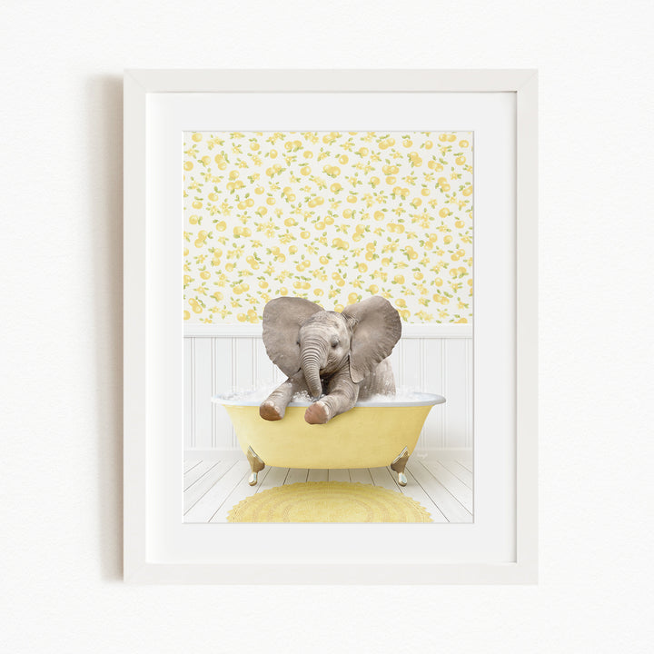 A baby elephant sitting in a yellow bathtub, surrounded by a yellow and white floral pattern on the wall behind it.