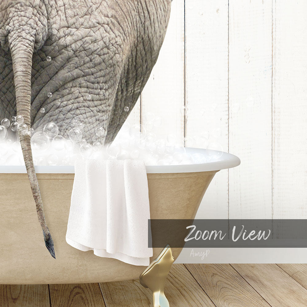 A close-up of an elephant's trunk in a bathtub filled with water, with bubbles around it.