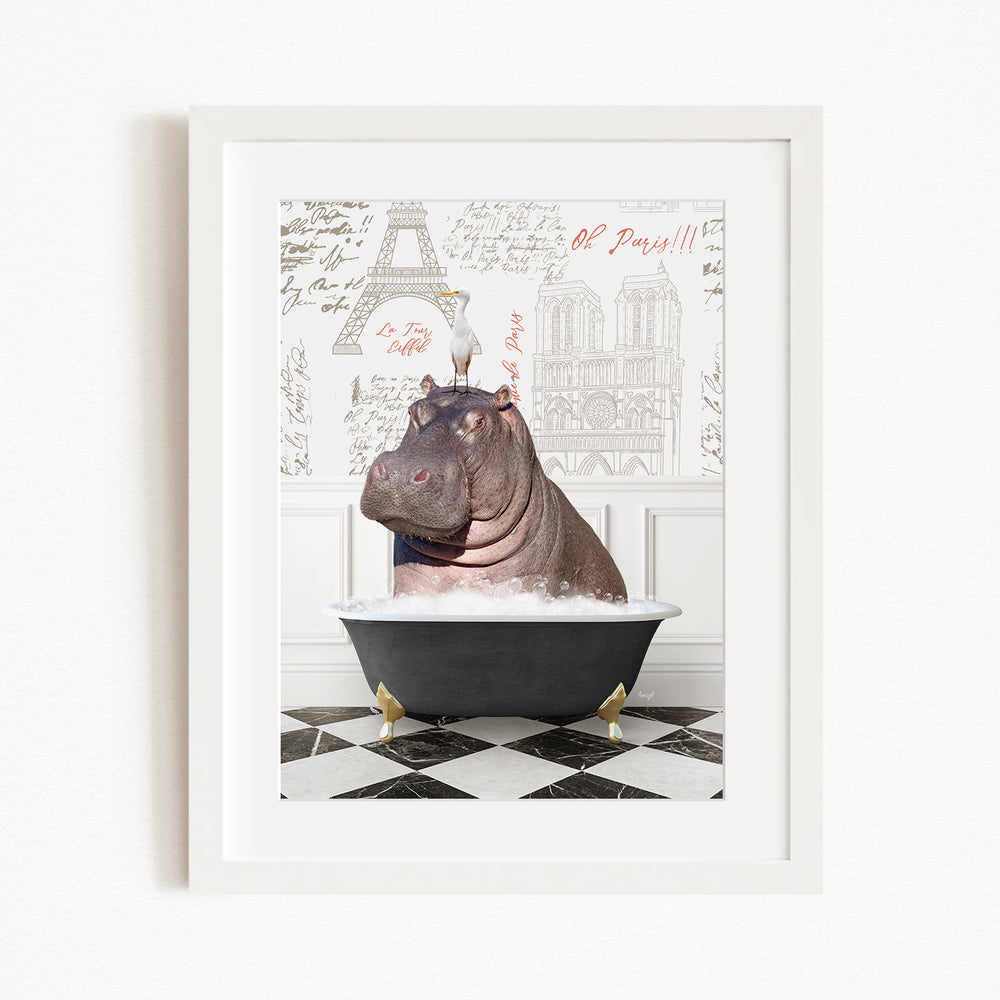 A framed image depicting a hippopotamus sitting in a bathtub, with a Paris-themed background featuring the Eiffel Tower and other Parisian landmarks.