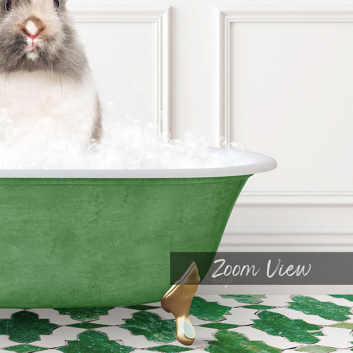 A fluffy white rabbit sitting in a green bathtub filled with bubbles, with a gold bathtub stopper visible.