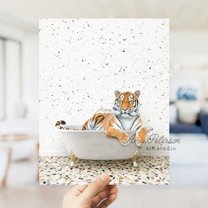 a hand holding up a card with a picture of a tiger in a bathtub