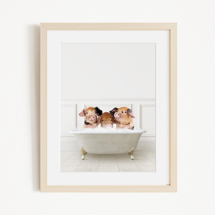 Three adorable pigs sitting in a white bathtub, enjoying a relaxing bath.