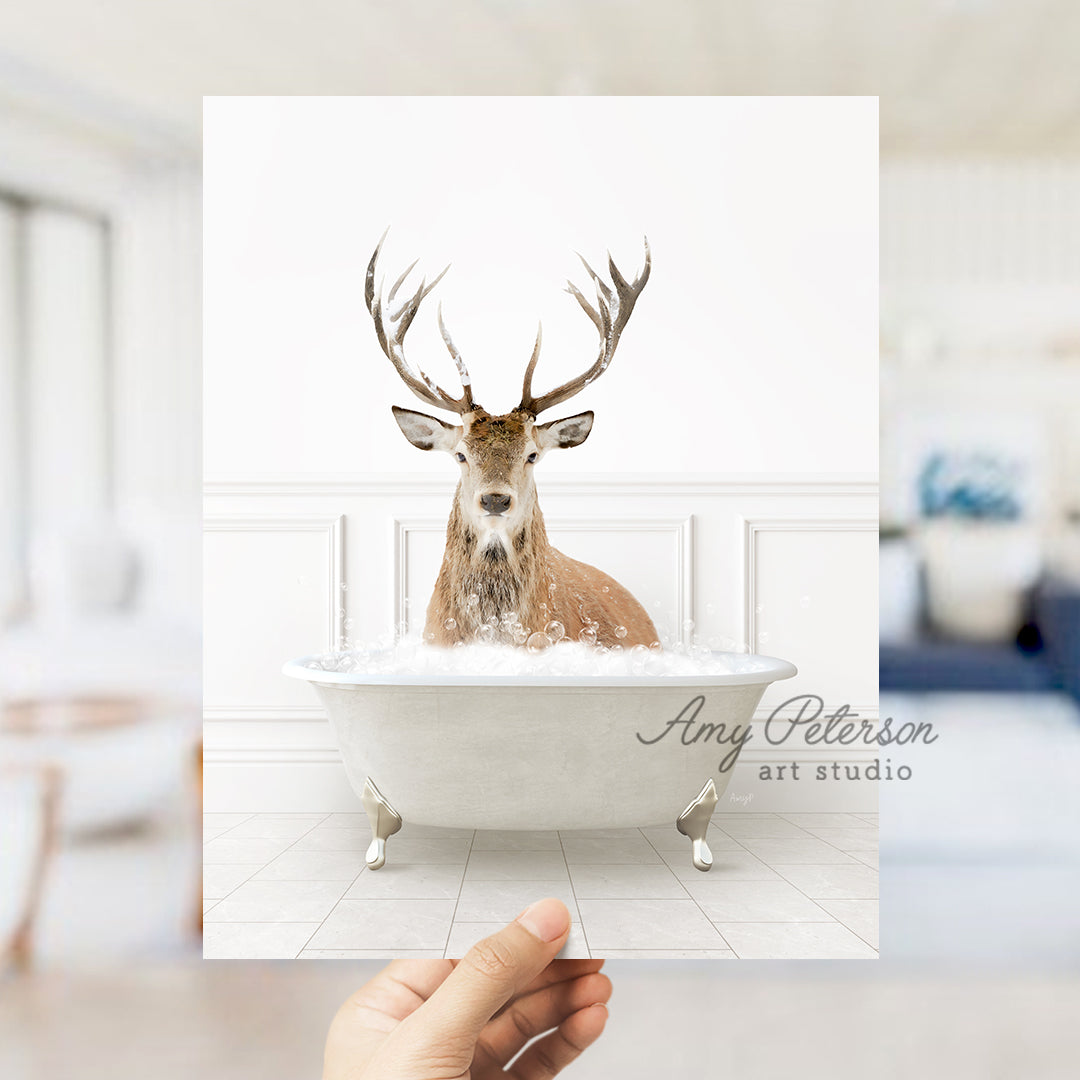 a hand holding up a card with a picture of a deer in a bathtub