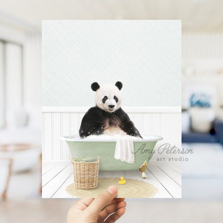 a person holding up a card with a panda in a bathtub