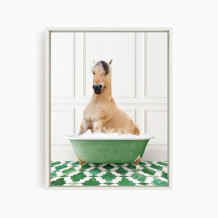 A light brown horse is sitting in a green bathtub filled with water, surrounded by a green and white patterned floor.