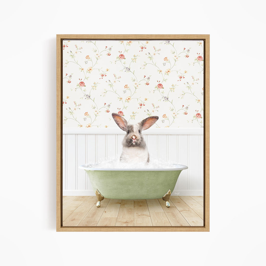 A cute rabbit sitting in a green bathtub filled with water, surrounded by a floral wallpaper.