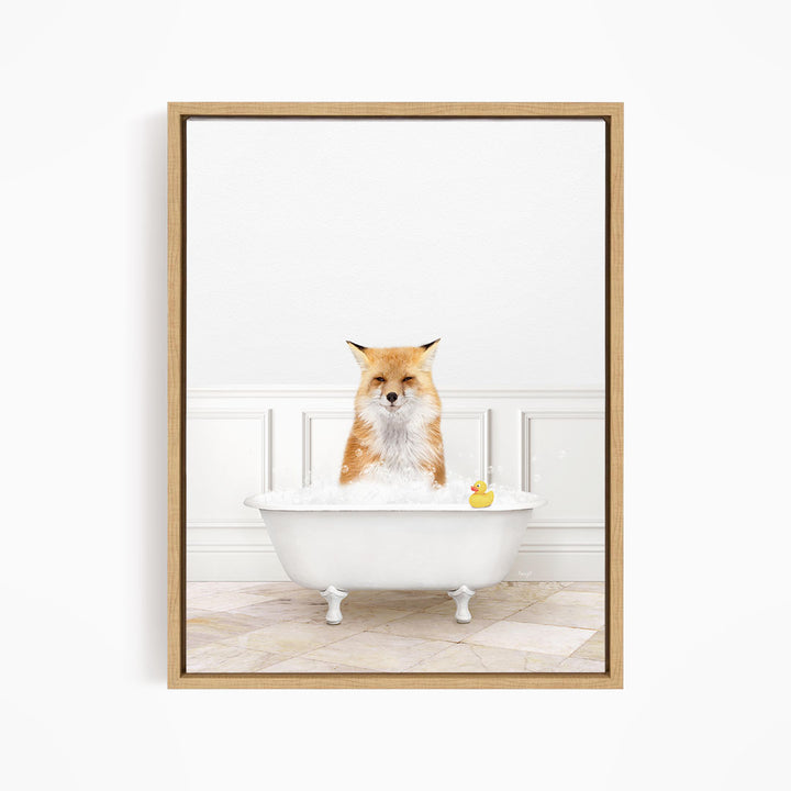 A red fox is sitting in a white bathtub filled with water, with a rubber duck floating in the water.