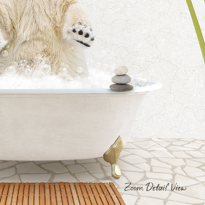 A polar bear is standing in a bathtub filled with bubbles, with a stack of rocks on the edge of the tub.