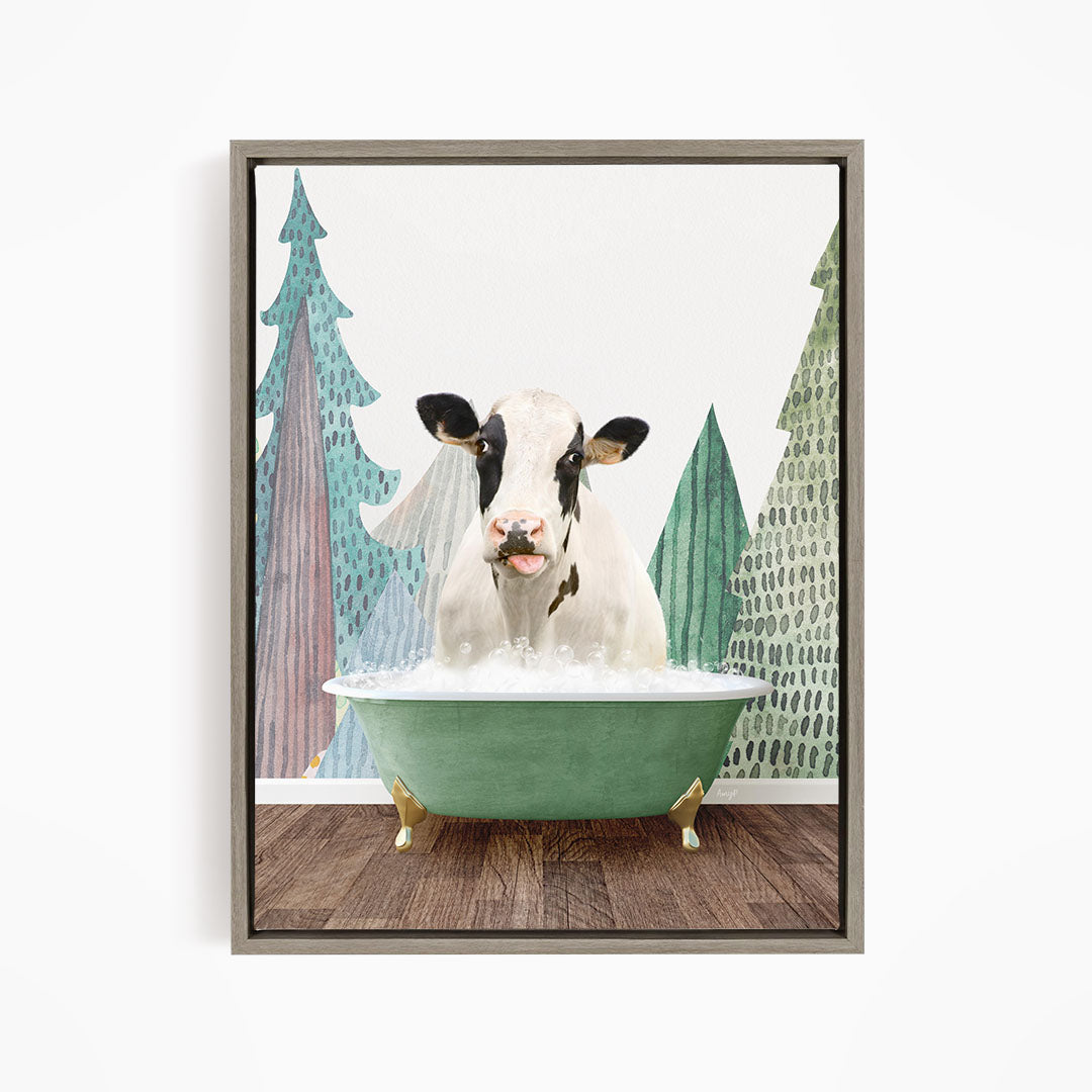 A cow is sitting in a green bathtub filled with water, surrounded by trees with green and brown foliage.