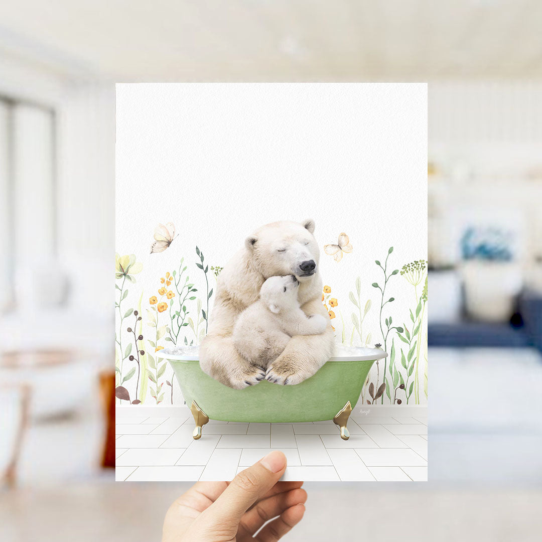A hand holds up a framed image depicting a polar bear sitting in a green bathtub, surrounded by flowers and butterflies.