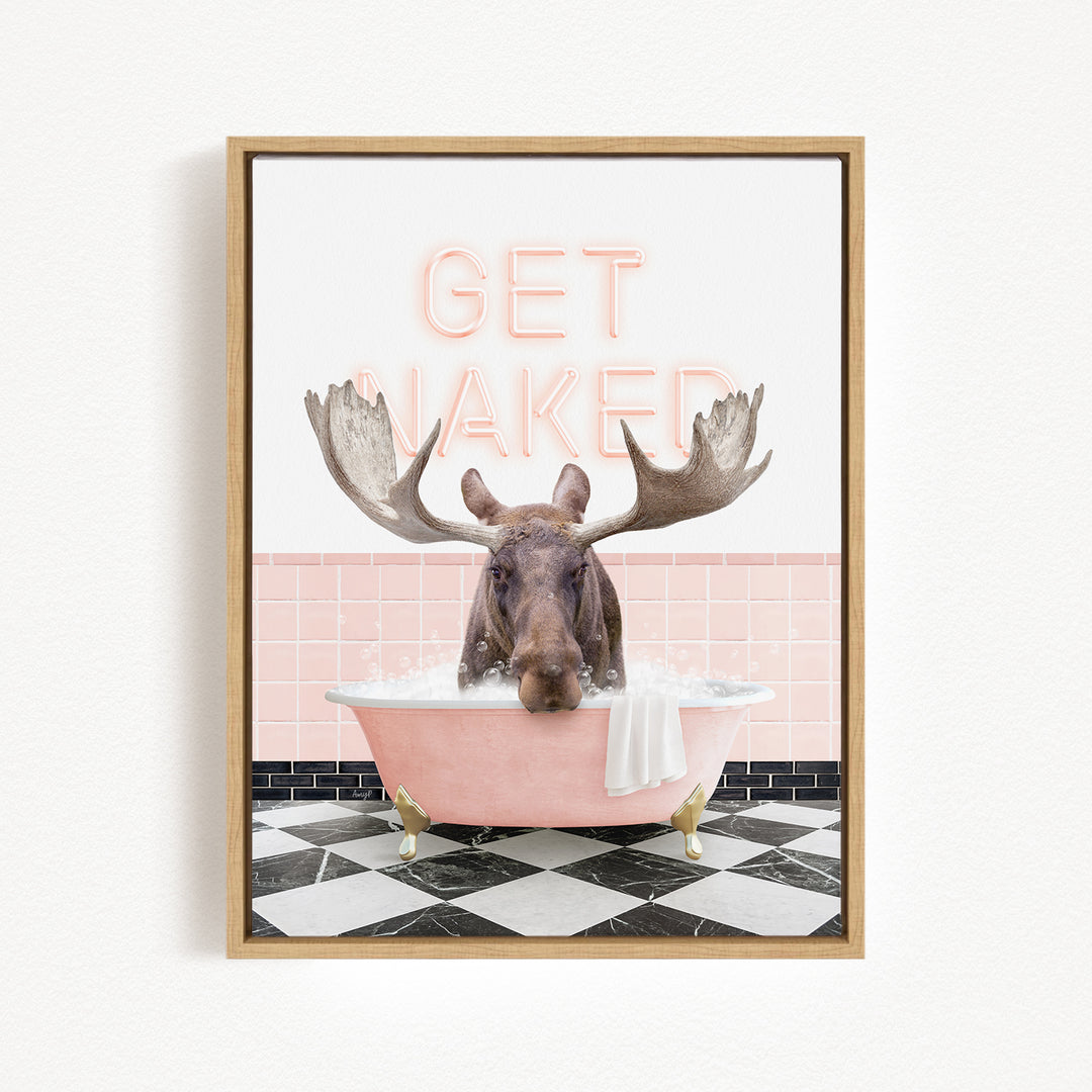 A framed image depicting a moose sitting in a pink bathtub with the text "GET NAKED" displayed above it.