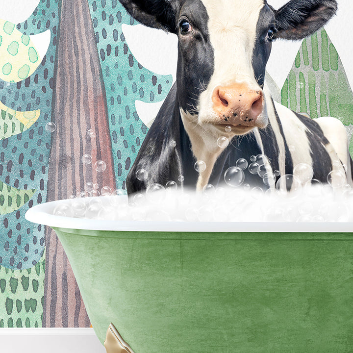 a black and white cow in a green bath tub