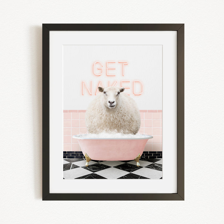 A framed image depicting a fluffy white sheep sitting in a pink bathtub with the text "GET NAKED" displayed above it.