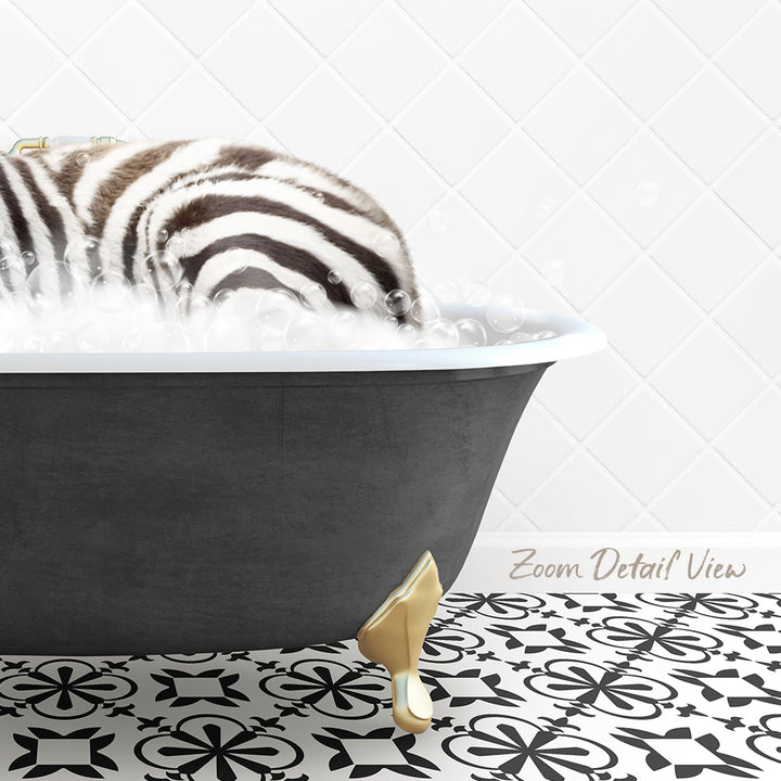 A zebra lying in a bathtub filled with bubbles, with a gold bathtub faucet and a patterned tile floor.