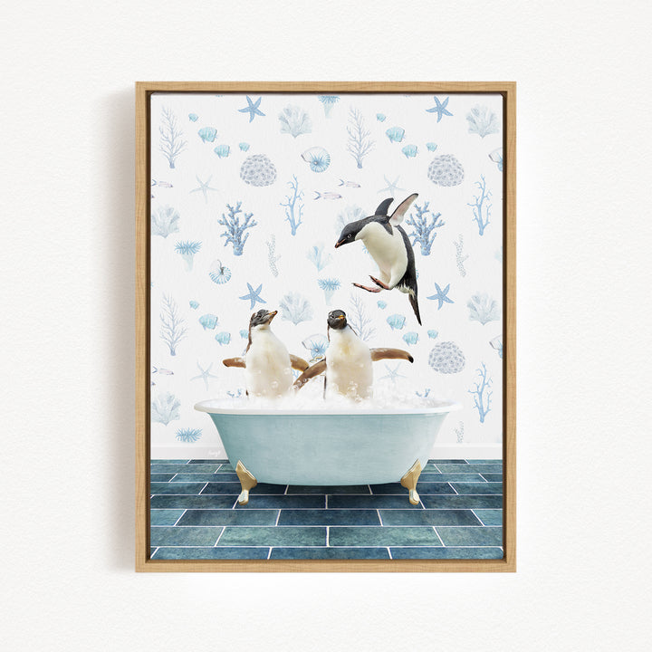 A framed image depicting two penguins sitting in a bathtub, with one penguin jumping out of the tub.