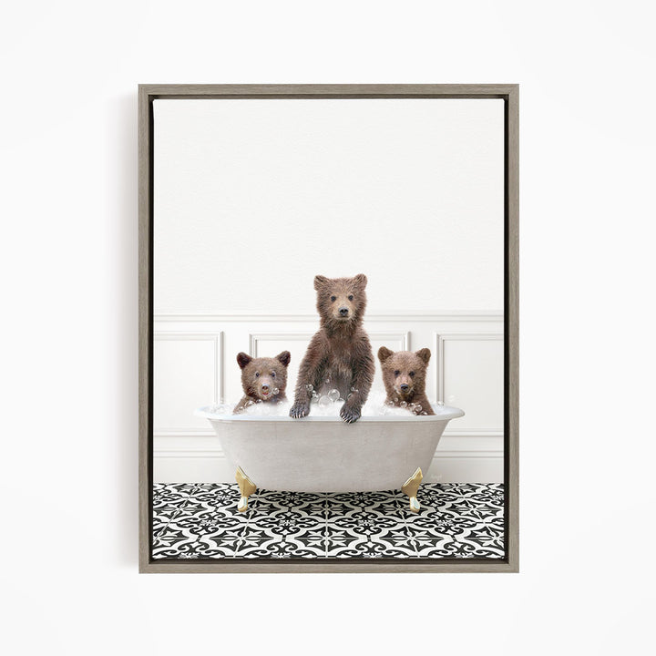 Three adorable brown bears sitting in a white bathtub, with one bear sitting in the center and the other two bears sitting on either side.