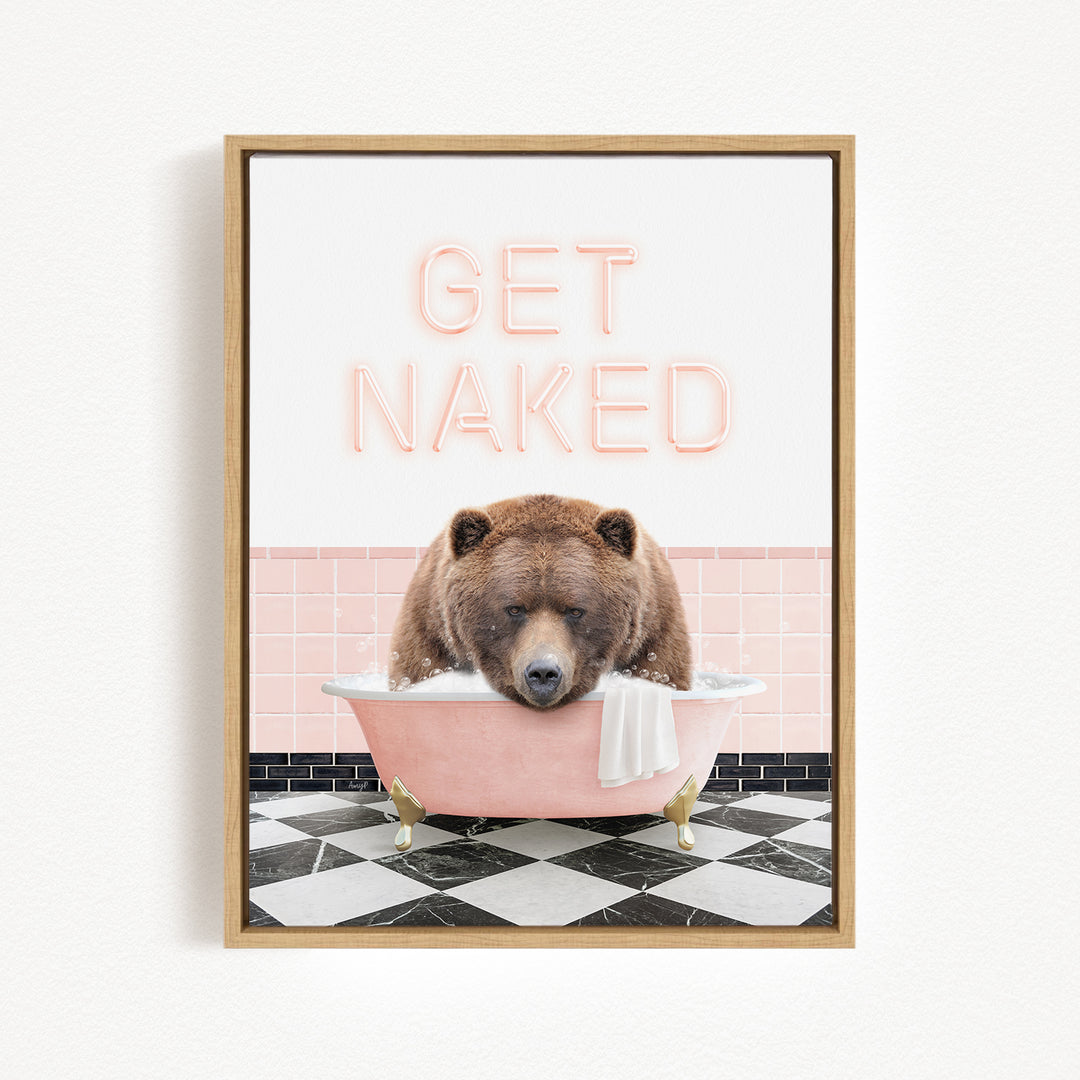 A framed image depicting a brown bear sitting in a pink bathtub, with the text "GET NAKED" displayed above it.