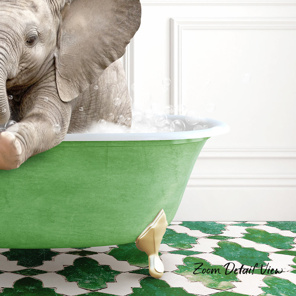 A baby elephant sitting in a green bathtub filled with bubbles, surrounded by a patterned green and white floor.