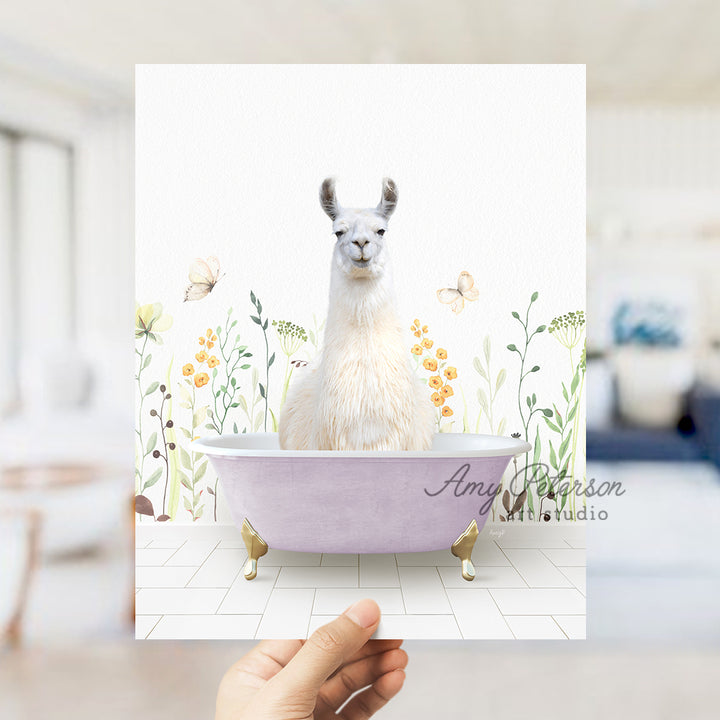 a llama sitting in a bathtub with flowers around it