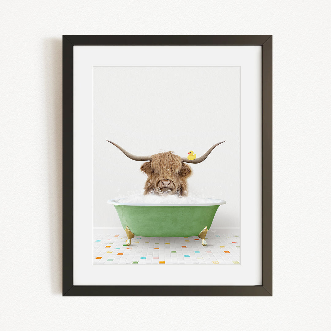 A Highland cow with long horns is sitting in a green bathtub, with a rubber duck floating on the water.