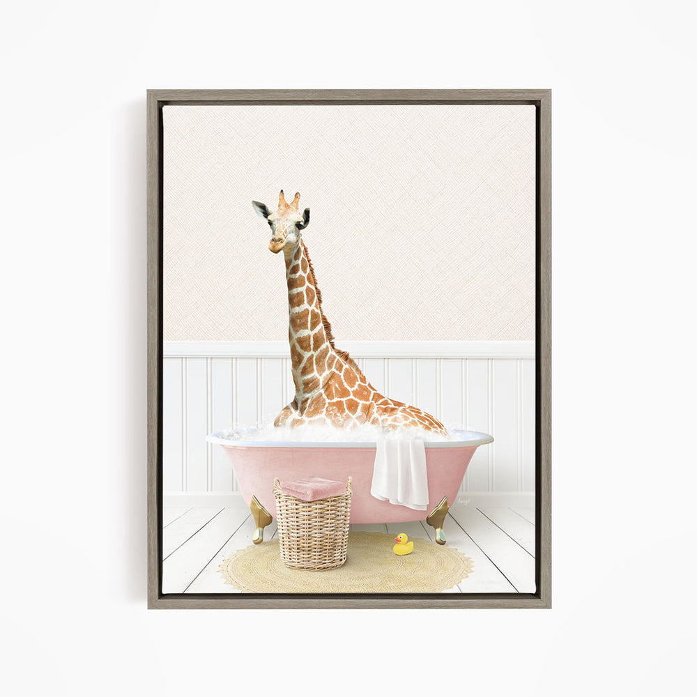 A giraffe sitting in a pink bathtub filled with water, surrounded by a basket of toys and a yellow rubber duck.