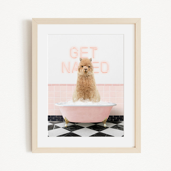 A framed image of a fluffy brown dog sitting in a pink bathtub, with the text "GET NAKED" displayed above it.