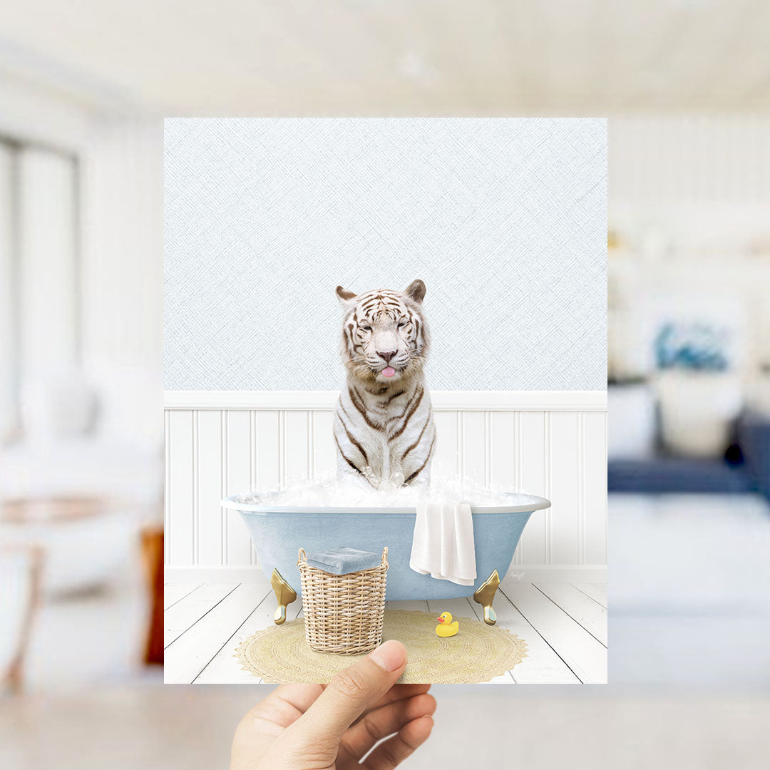 A white tiger sitting in a blue bathtub filled with water, surrounded by a yellow rubber duck and a wicker basket.