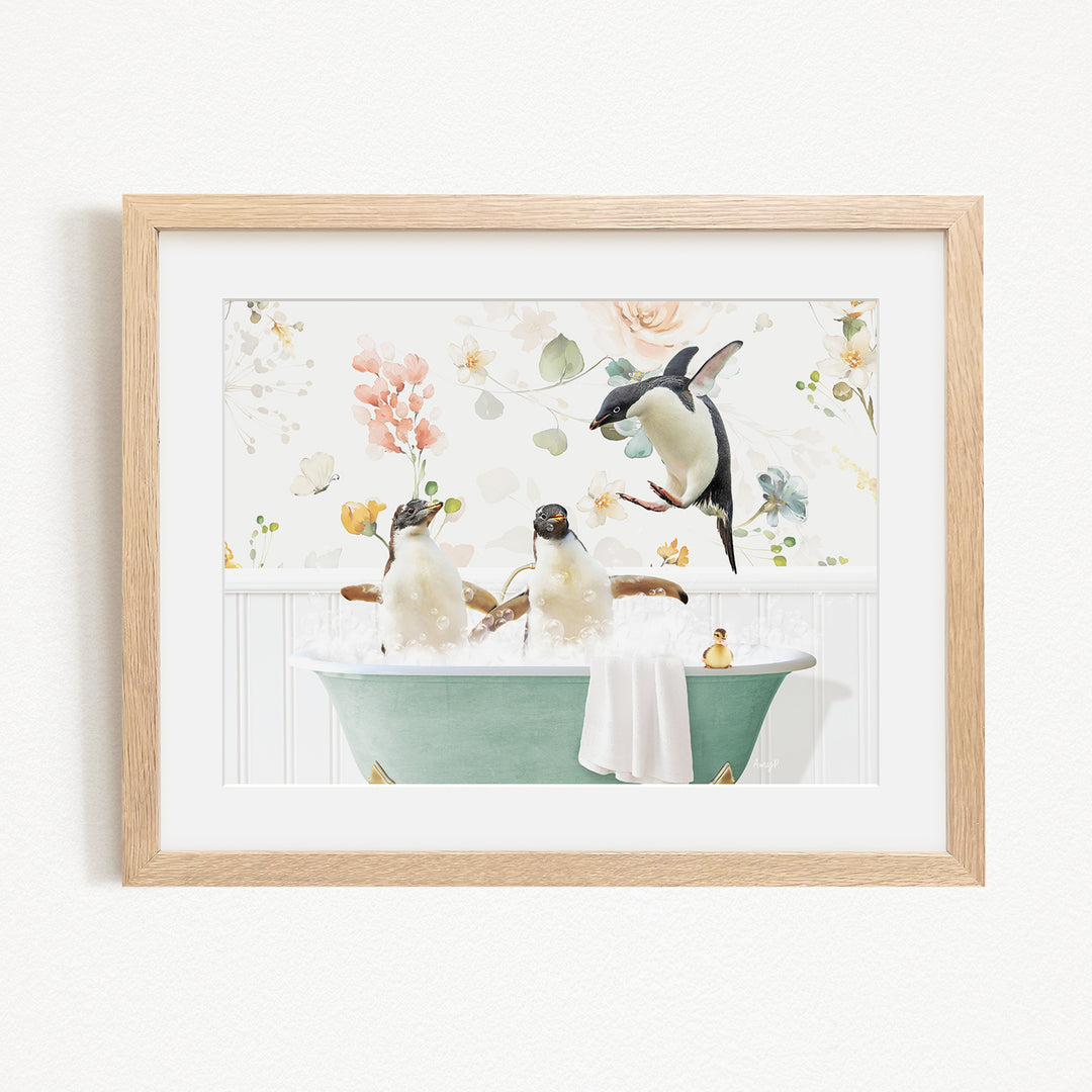 A framed image depicting three penguins sitting in a green bathtub, surrounded by flowers and greenery.