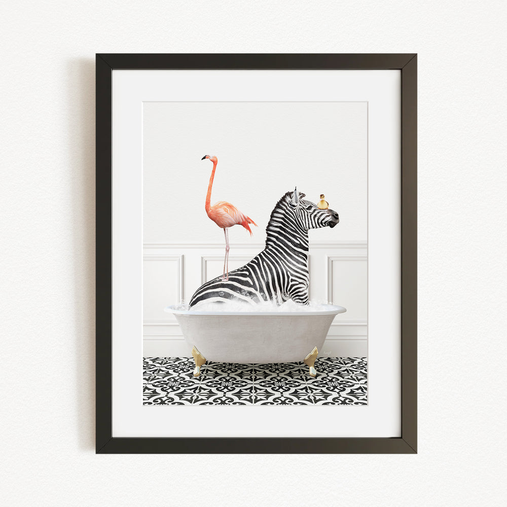A framed image depicting a zebra sitting in a bathtub, with a flamingo standing on its back and a bird perched on its head.