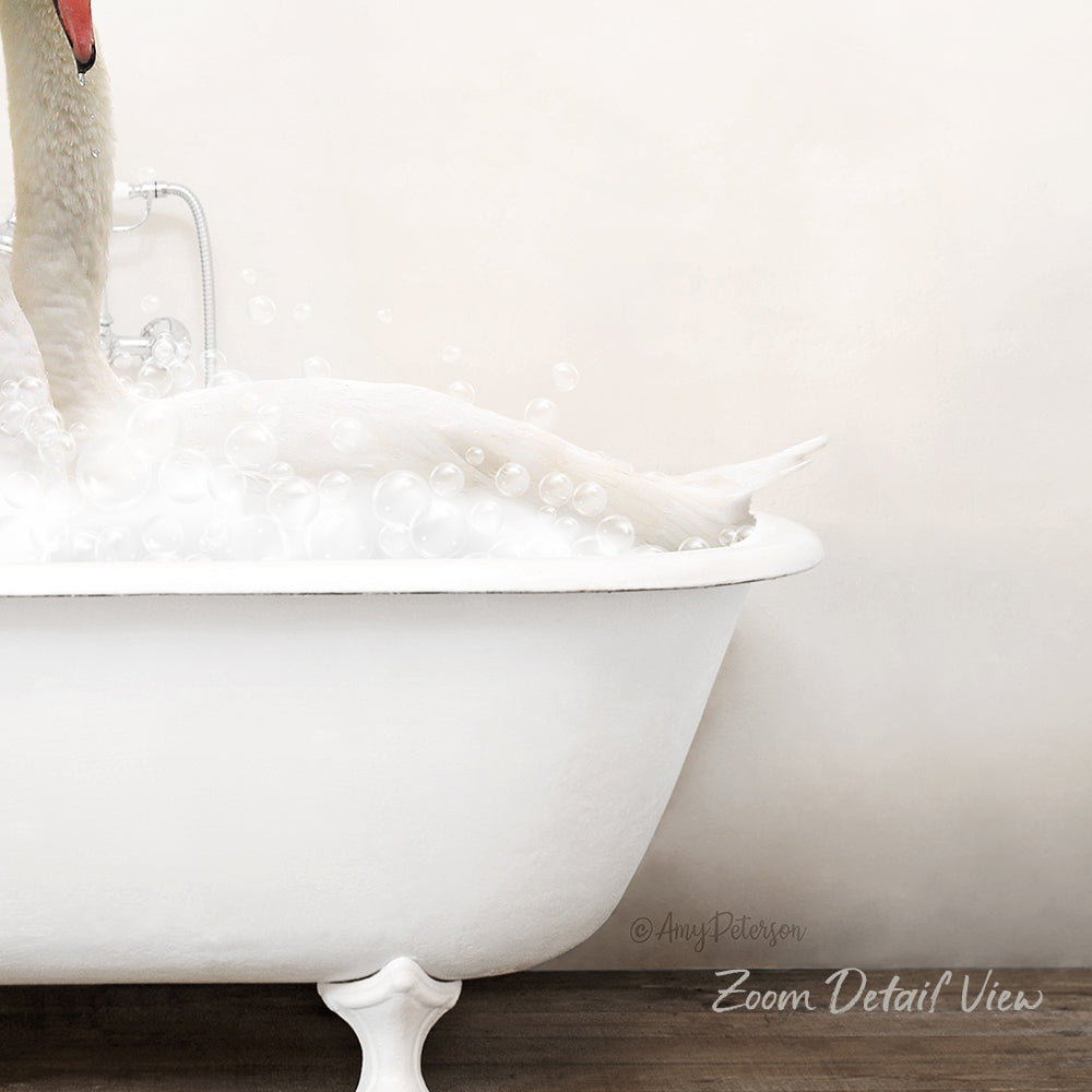 A white bathtub filled with bubbles, with a swan's head submerged in the water.