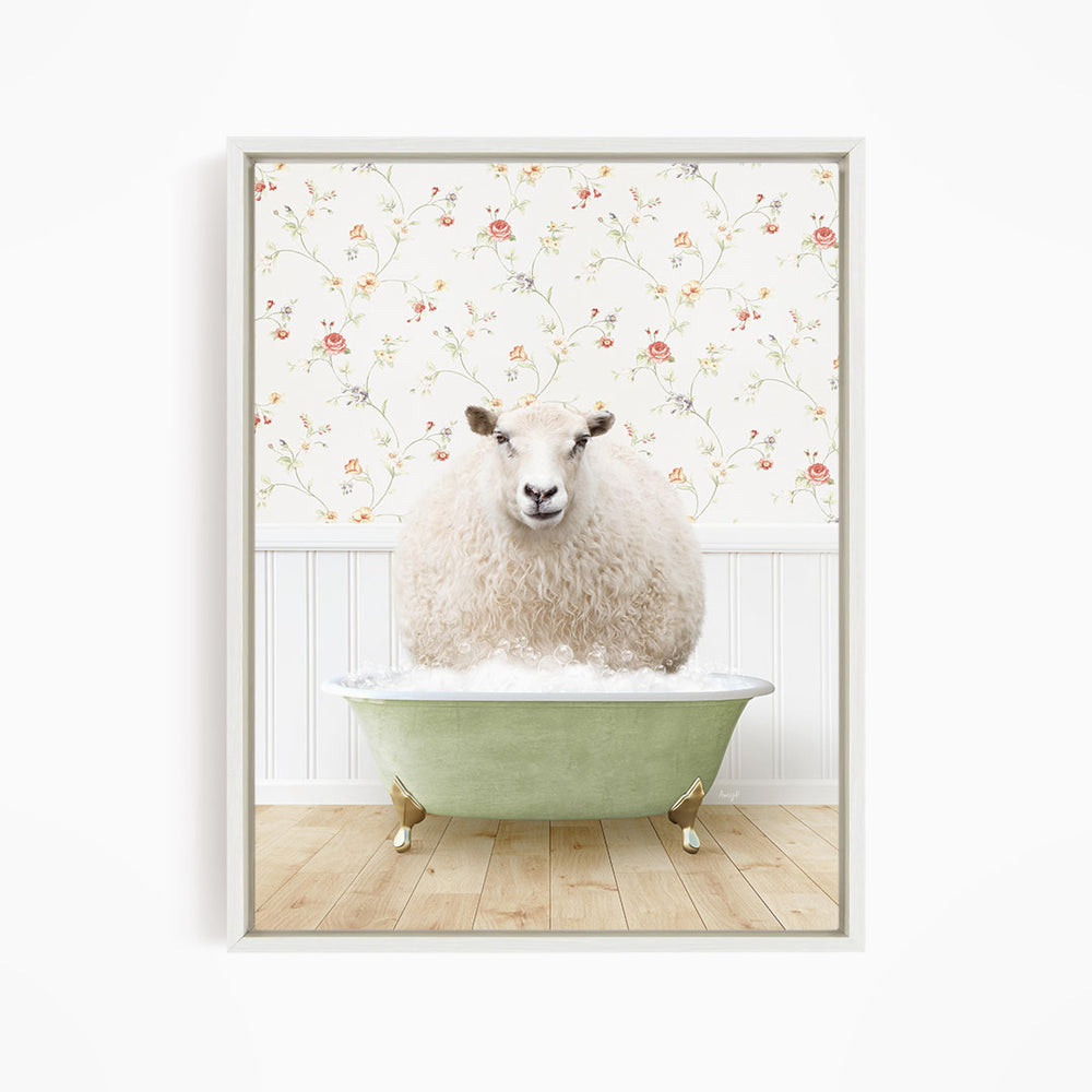 A fluffy white sheep sits in a green bathtub, surrounded by a floral wallpaper.