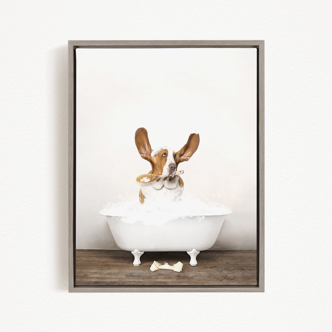 A dog sitting in a white bathtub filled with bubbles, looking directly at the camera with its ears perked up.