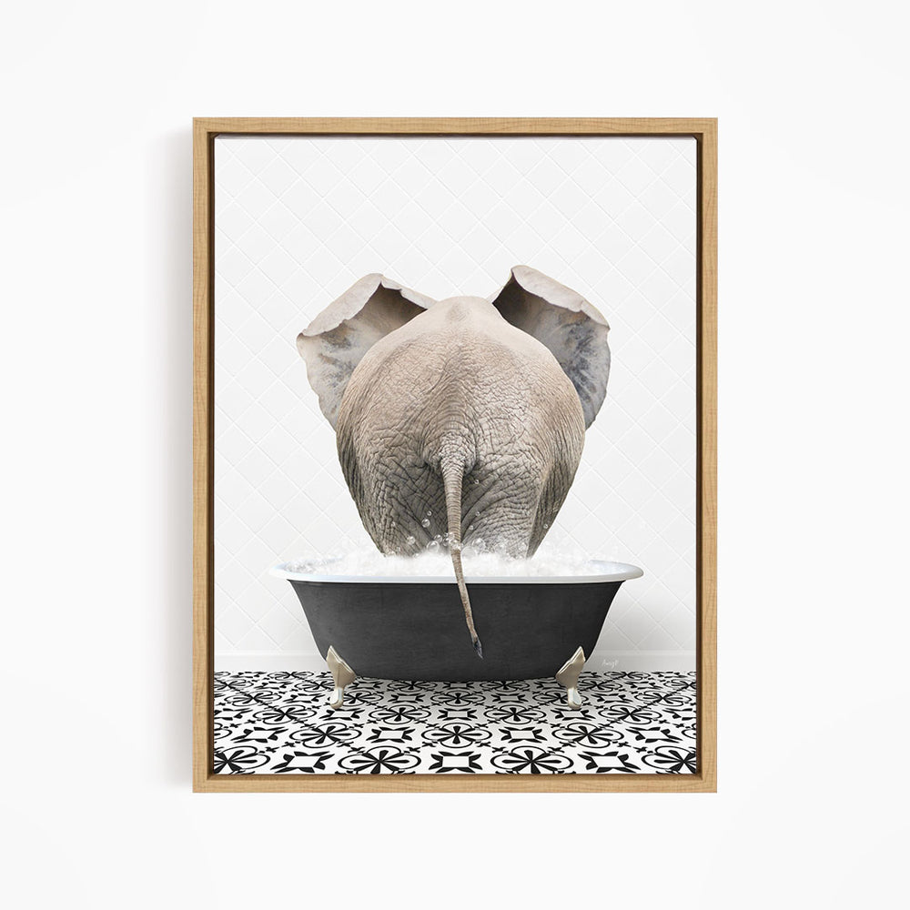 A gray elephant is standing in a black bathtub filled with water, with its trunk submerged in the water.