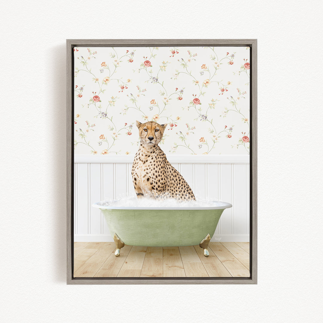 A cheetah sitting in a green bathtub filled with water, with a floral wallpaper in the background.