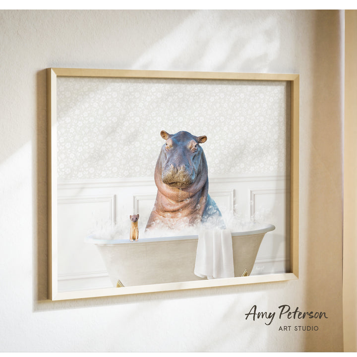 A framed image depicting a hippopotamus sitting in a bathtub, with a small animal, likely a dog, sitting next to it.