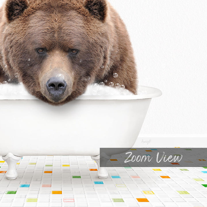 A large brown bear is sitting in a white bathtub filled with water, surrounded by colorful tiles on the floor.