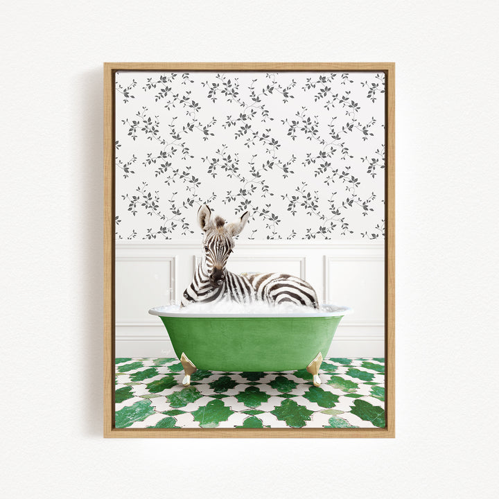 A zebra is sitting in a green bathtub, surrounded by a patterned wall and green and white floor tiles.