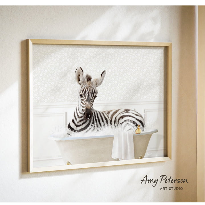 A zebra is sitting in a bathtub filled with water, surrounded by a towel and a rubber duck.